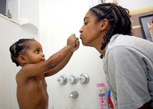 Cristie Oliver gives Asia a bath before bed. When Oliver got her Army mailgram, she said, They're going to make me leave my baby.